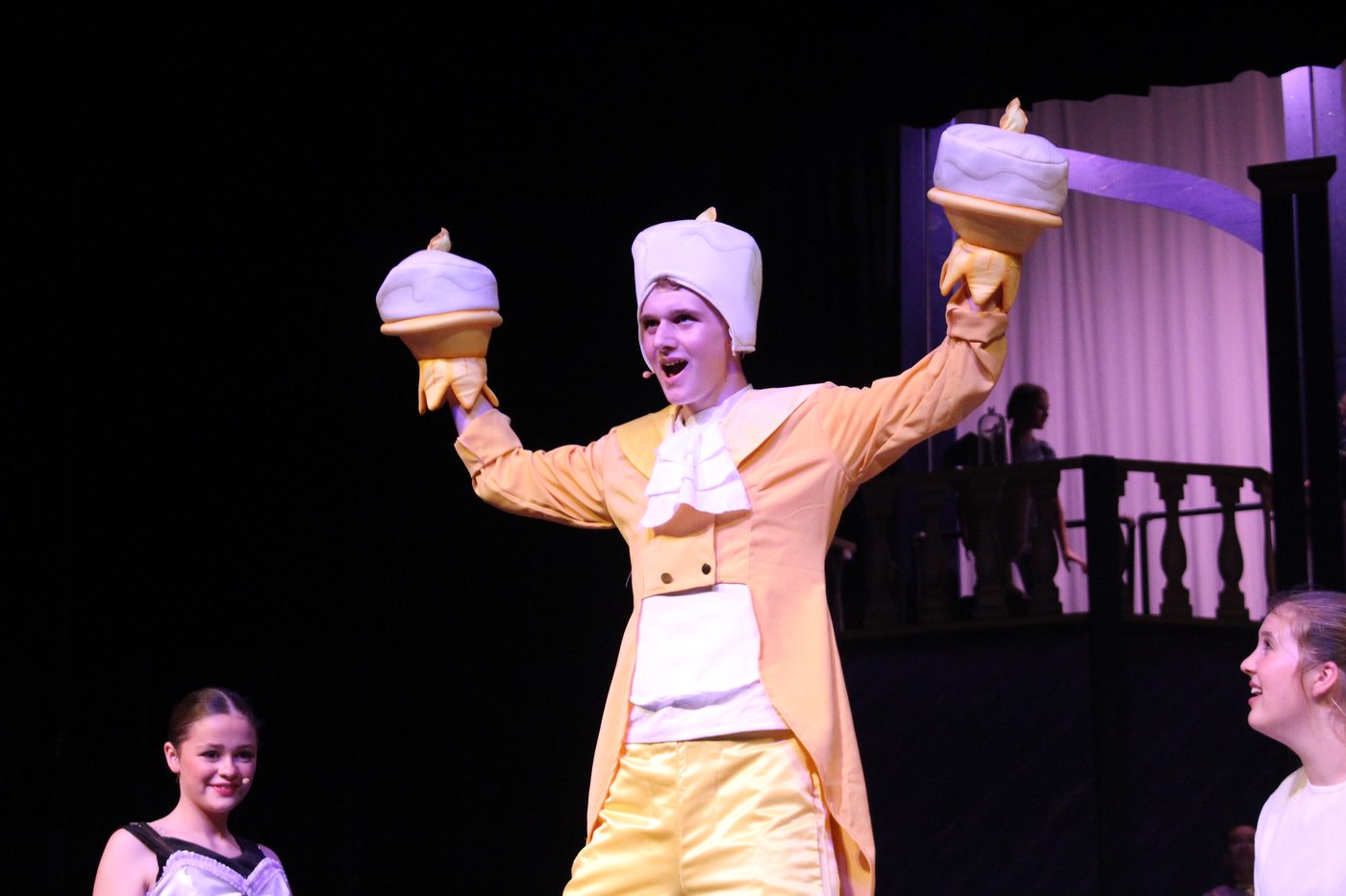 Student performing as Lumiere in Beauty and the Beast