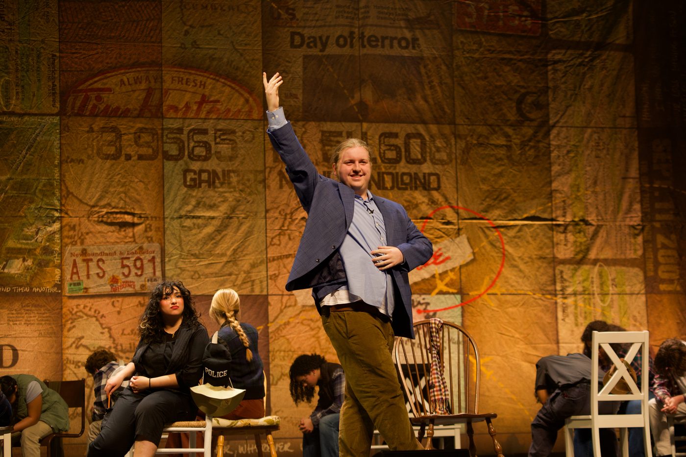 Performer center stage in Come From Away